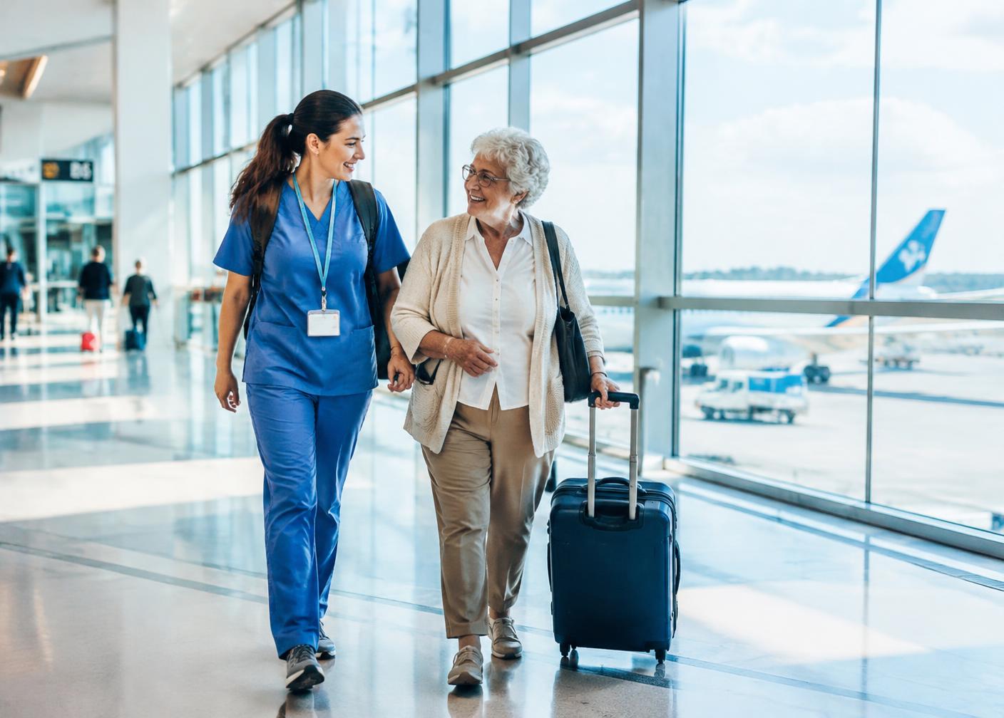 Nurse companion walking with a traveler through an airport